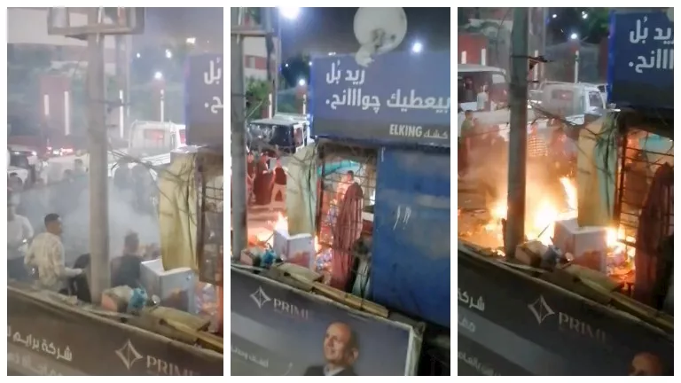 صاحب كشك بأسيوط يشعل النار به اعتراضًا على حملة إزالة مخالفة- صور