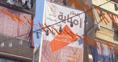 بانر للمتحف المصرى الكبير يزين مائدة الإفطار الجماعى بإمبابة